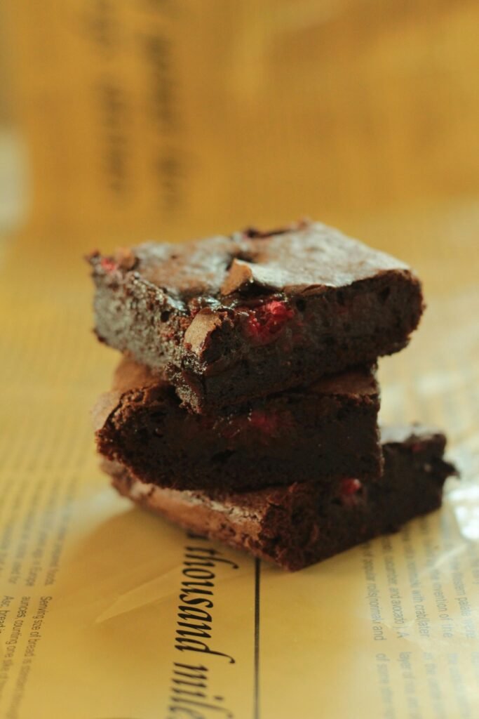 Close-up of luscious chocolate brownies stacked, showcasing their gooey texture and rich flavor. Why These Gluten Free Brownies Shine