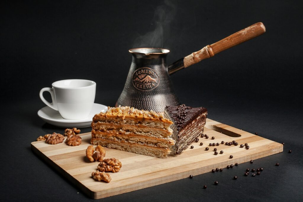 Delightful Armenian coffee setup with chocolate and nut cake, perfect for indulgence.