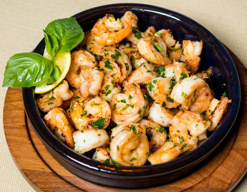 Delicious grilled shrimp with herbs and lemon in a wooden bowl. Easy Shrimp Scampi Recipe